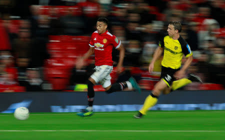 Soccer Football - Carabao Cup Third Round - Manchester United vs Burton Albion - Old Trafford, Manchester, Britain - September 20, 2017 Manchester United's Jesse Lingard in action with Burton Albion's Stephen Warnock Action Images via Reuters/Jason Cairnduff