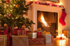 Christmas tree and stocking near fireplace