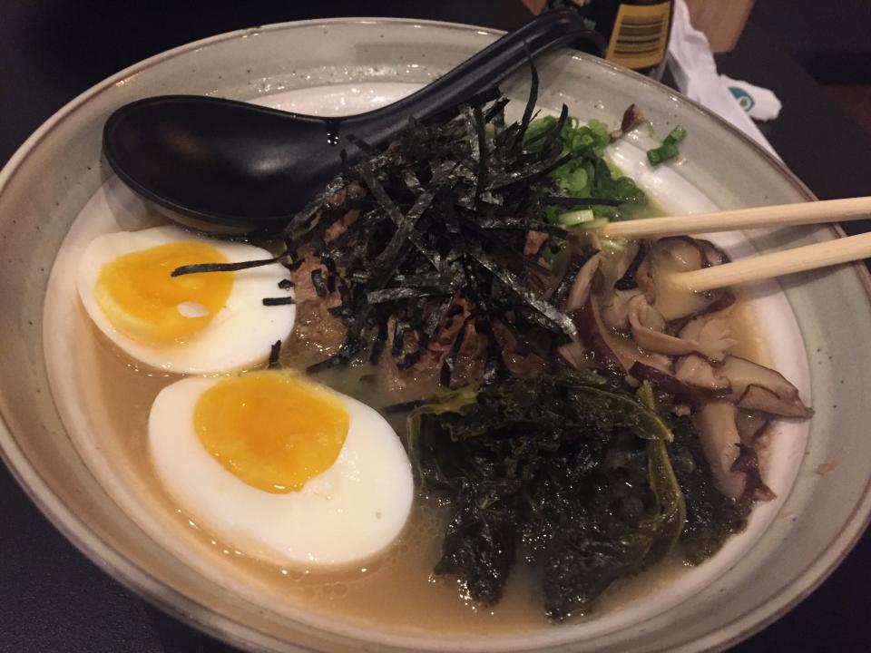 The tonkotsu at Fin-Two Japanese Ale features pork broth, pork belly, kale, shitake mushrooms, burnt garlic oil, negi, nori and soft-boiled egg.