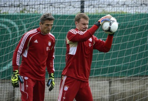 Bayern Munich goalkeepers Manuel Neuer (R) and Rouven Sattelmaier during a training session in Berlin on May 11. The Bavarians host the Champions League final against Chelsea on May 19 and while they could be forgiven for being distracted, Neuer insists all eyes are on Berlin