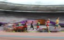 Galen Rupp (2nd R) of the U.S. runs with other competitors in their men's 5000m round 1 heat at the London 2012 Olympic Games at the Olympic Stadium August 8, 2012.