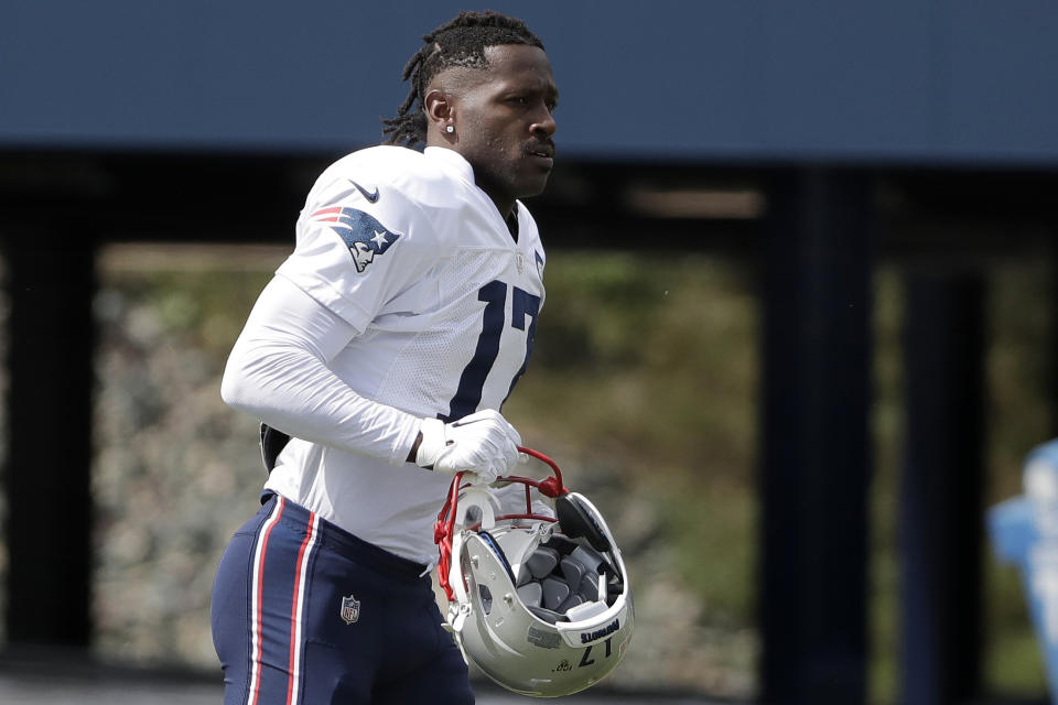 FILE - In this Wednesday, Sept. 18, 2019, file photo, New England Patriots wide receiver Antonio Brown carries his helmet during an NFL football practice in Foxborough, Mass. The Patriots released Brown on Friday, Sept. 20, 2019. (AP Photo/Steven Senne, File)