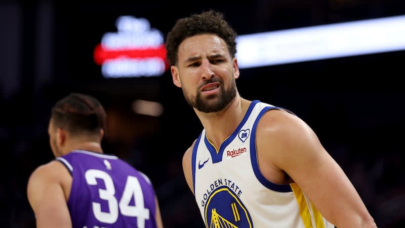 Golden State Warriors guard Klay Thompson (11) reacts after making a three-point basket against the Utah Jazz during a game in San Francisco, Sunday, April 14, 2024.