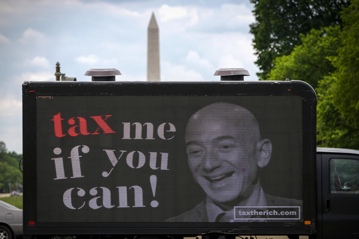 WASHINGTON, DC - MAY 17: A mobile billboard calling for higher taxes on the ultra-wealthy depicts an image of billionaire businessman Jeff Bezos, near the U.S. Capitol on May 17, 2021 in Washington, DC. Organized by the group 