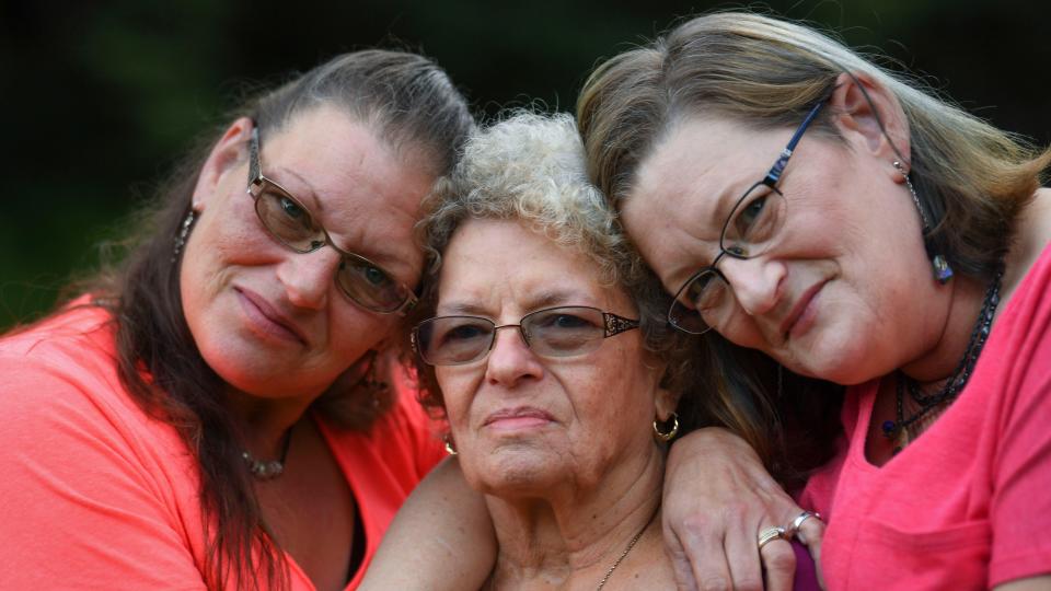  8/28/19 7:11:42 PM -- Clarksburg, WV, U.S.A  -- Mary Shaw, left and Linda Shaw, right, with their mother Norma Shaw, who was married to  Air Force veteran George Nelson Shaw Sr., who died on on April 10, 2018, at the VA hospital in Clarksburg, W. Va. His death, ruled a homicide by an Armed Forces examiner, is one of 10 under investigation by federal authorities. He was 81. 

  --    Photo by Jack Gruber, USA TODAY staff