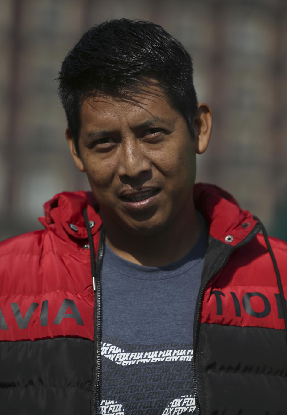 Damian Banuelos poses for a photo during an interview in the Zocalo in Mexico City, Friday, Nov. 29, 2019. Banuelos is a Huichol artisan from the mountains of Nayarit, a state on the Pacific coast, who feels that the Mexican president is far more accessible and in touch with the people than his predecessors. (AP Photo/Marco Ugarte)