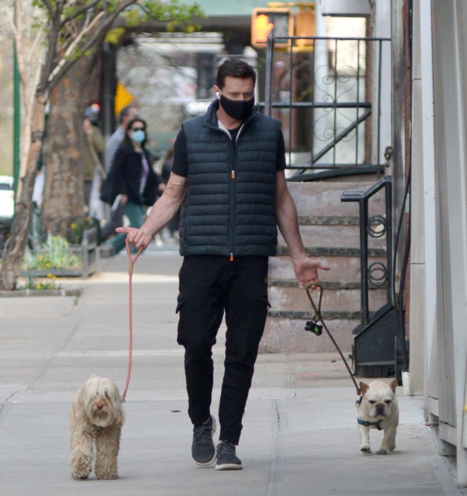 <p>Hugh Jackman has his hands full during a Sunday stroll through N.Y.C.</p>