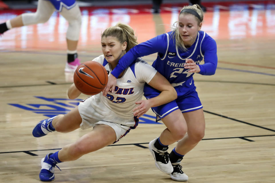 Creighton guard Chloe Dworak, right defends against DePaul's Jorie Allen during the first half of an NCAA college basketball game, Saturday, Feb. 20, 2021, in Chicago. (AP Photo/Shafkat Anowar)