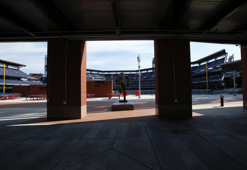 An empty Ashburn Alley faces seats at Citizens Bank Park on Monday, July 27, 2020, in Philadelphia. The Philadelphia Phillies' game against the New York Yankees on Monday was postponed after several members of the Miami Marlins tested positive for the coronavirus. (Yong Kim/The Philadelphia Inquirer via AP)
