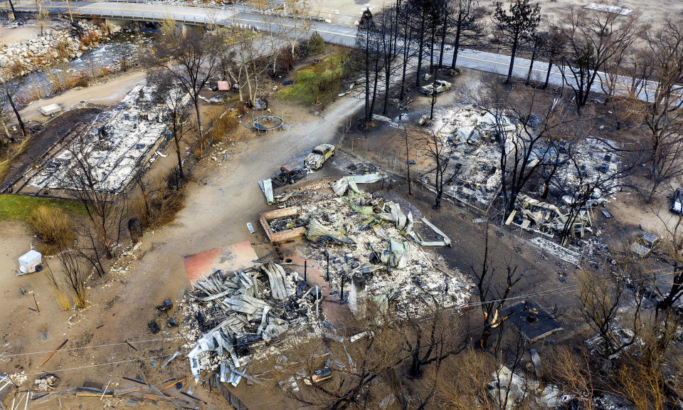 In this photo taken by a drone, homes destroyed by the Mountain View Fire line a street in the Walker community in Mono County, Calif., Wednesday, Nov. 18, 2020. (AP Photo/Noah Berger)