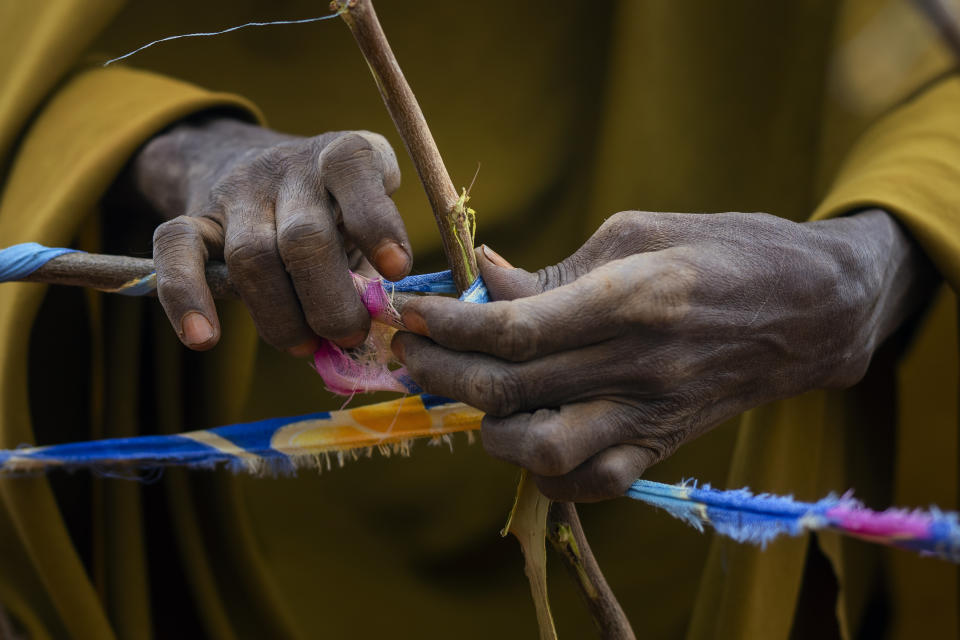 Sticks and cloth are used to make shelter at a camp for displaced people on the outskirts of Dollow, Somalia, on Tuesday, Sept. 20, 2022. Somalia is in the midst of the worst drought anyone there can remember. A rare famine declaration could be made within weeks. Climate change and fallout from the war in Ukraine are in part to blame. (AP Photo/Jerome Delay)