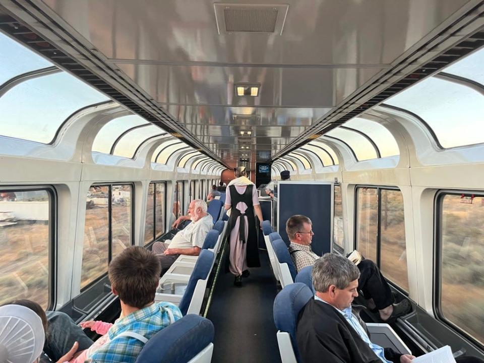 crowded observation car on an amtrak train