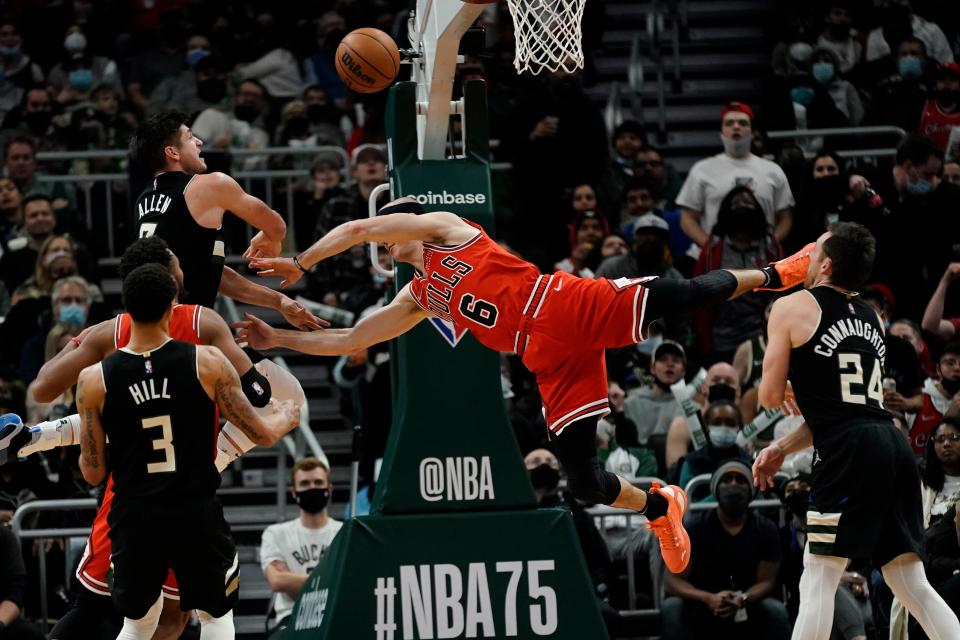 Grayson Allen fouls Alex Caruso during the game between the Bucks and Bulls.