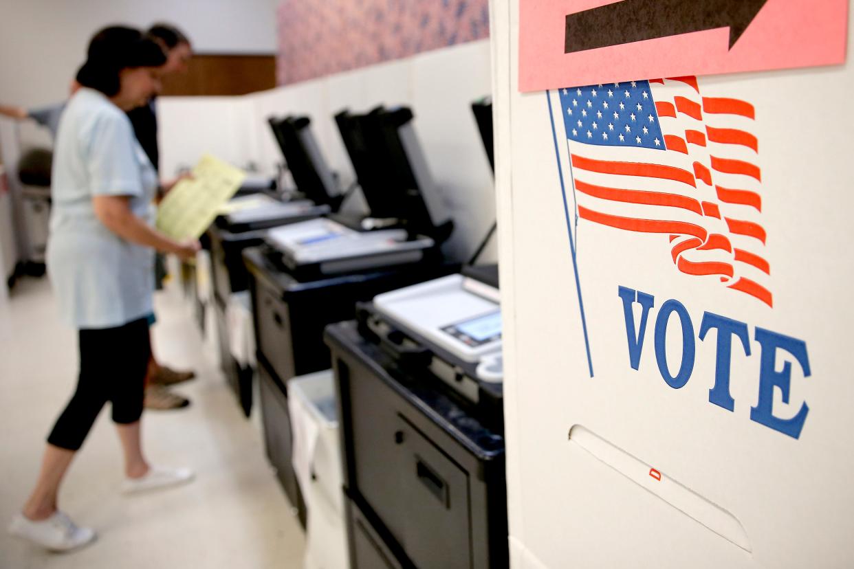 Voters cast ballots during early voting June 23, 2022, at the Oklahoma County Election Board in Oklahoma City.