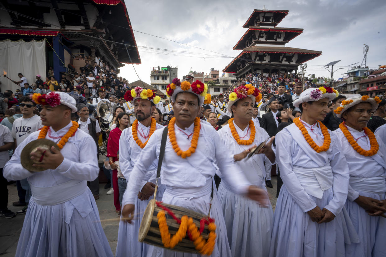 Devotees play traditional drums during Indra Jatra, a festival that marks the end of the rainy season in Kathmandu, Nepal, Tuesday, Sept. 17, 2024. (AP Photo/Niranjan Shrestha)