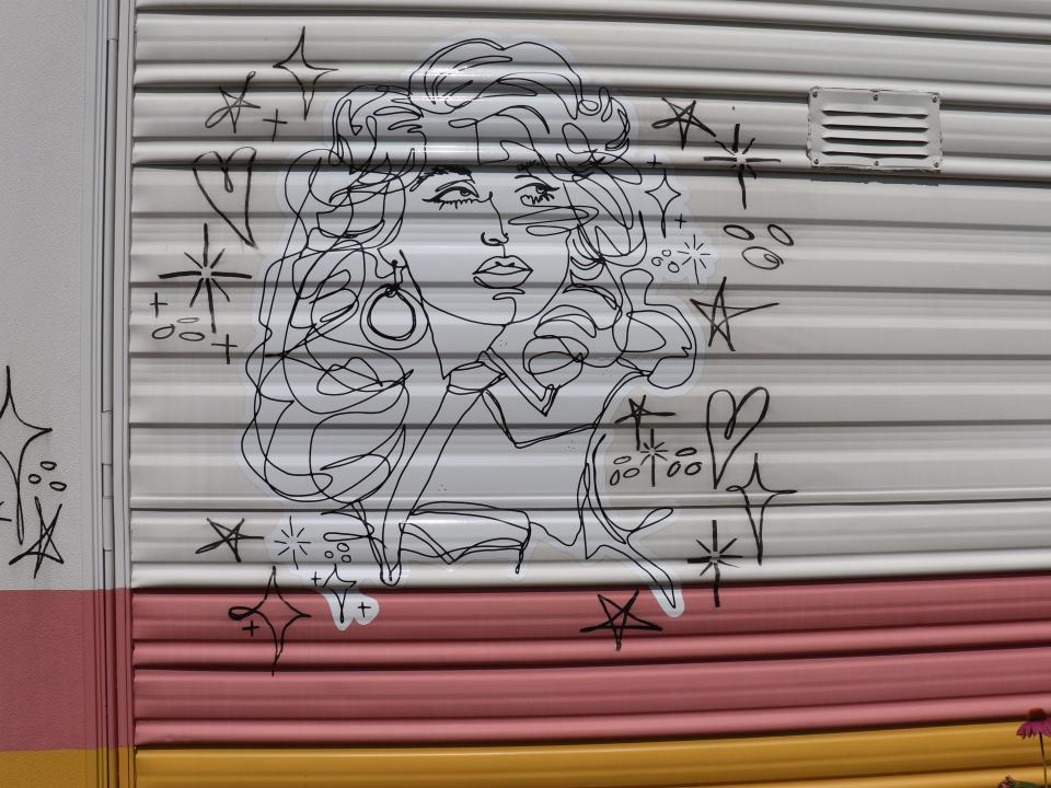 A mural of Dolly Parton on an RV