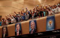 Supporters of Turkish President Tayyip Erdogan cheer as he speaks during a meeting of his ruling AK Party (AKP) in Istanbul, Turkey, August 20, 2017. REUTERS/Murad Sezer