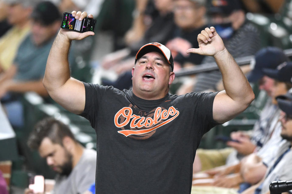 Orioles fan gives thumbs down at Camden Yards.