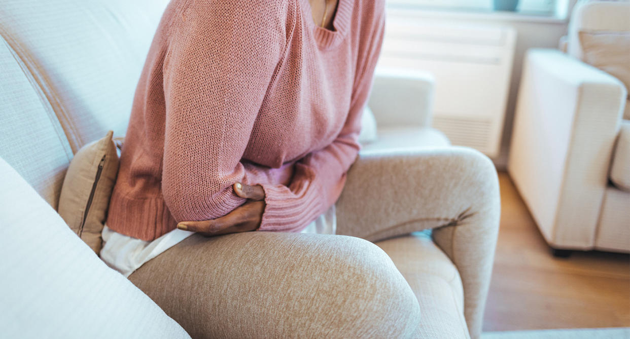 Woman with ovarian cancer symptom. (Getty Images)