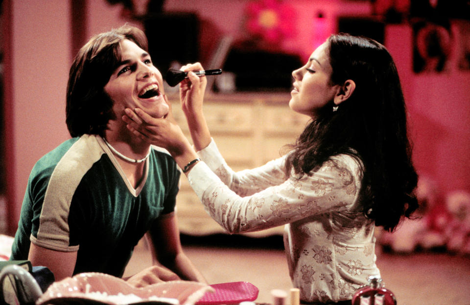 Ashton Kutcher and Mila Kunis on That 70's Show. (Alamy )