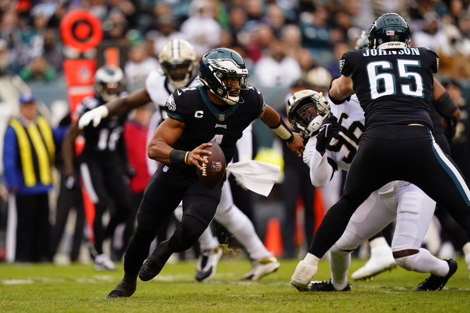 Philadelphia Eagles' Jalen Hurts scrambles during the first half of an NFL football game against the New Orleans Saints, Sunday, Nov. 21, 2021, in Philadelphia. (AP Photo/Derik Hamilton)