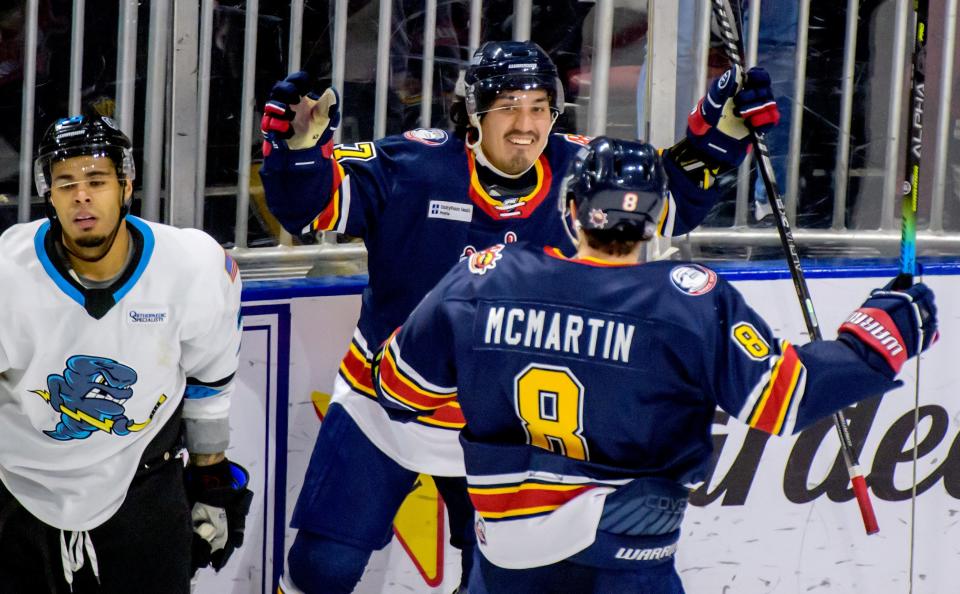 Peoria's Francesco Corona (27) celebrates his game-winning goal with teammate Brandon McMartin (8) in the overtime period Friday, Jan. 21, 2022 at Carver Arena. The Rivermen defeated the Quad City Storm 3-2 in sudden-death overtime.