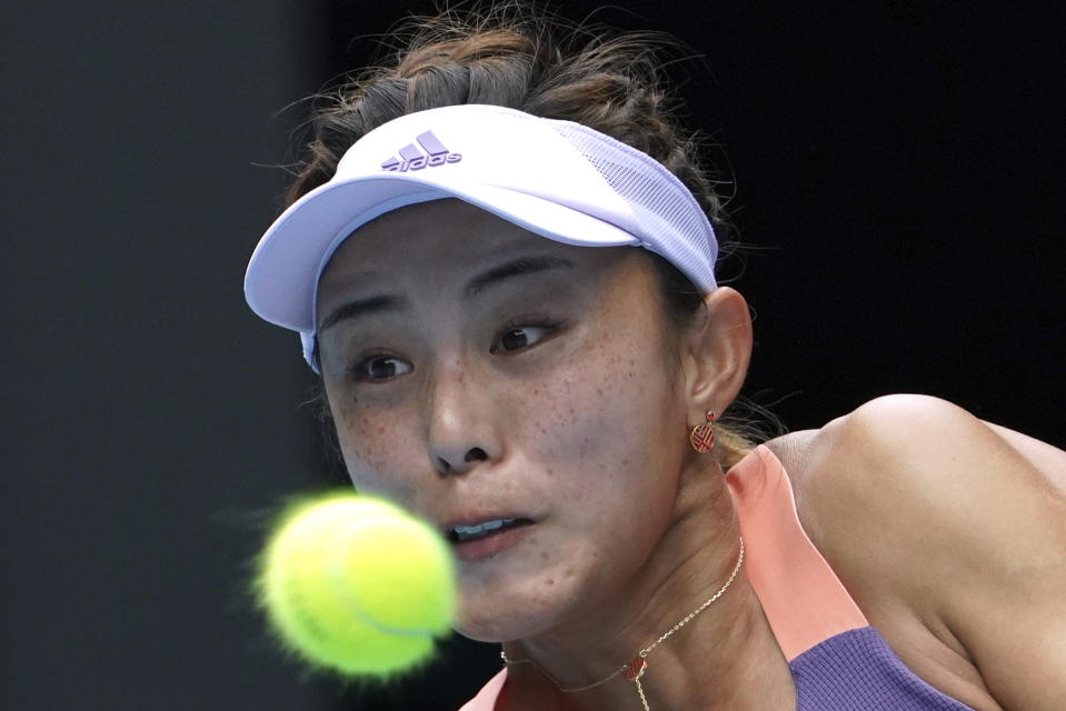 China's Wang Qiang returns a shot to Serena Williams of the U.S. in their third round singles match at the Australian Open tennis championship in Melbourne, Australia, Friday, Jan. 24, 2020. (AP Photo/Lee Jin-man)