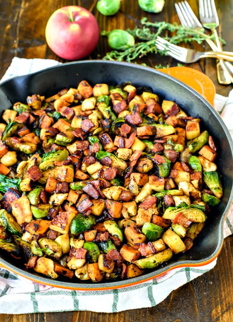 <p>Packed with some of fall's best flavors, this easy dinner will be ready in 30 minutes. </p><p><strong>Get the recipe at <a rel="nofollow noopener" href="http://www.wellplated.com/chicken-apple-sweet-potato-and-brussels-sprouts-skillet/" target="_blank" data-ylk="slk:Well Plated;elm:context_link;itc:0;sec:content-canvas" class="link ">Well Plated</a>. </strong></p>