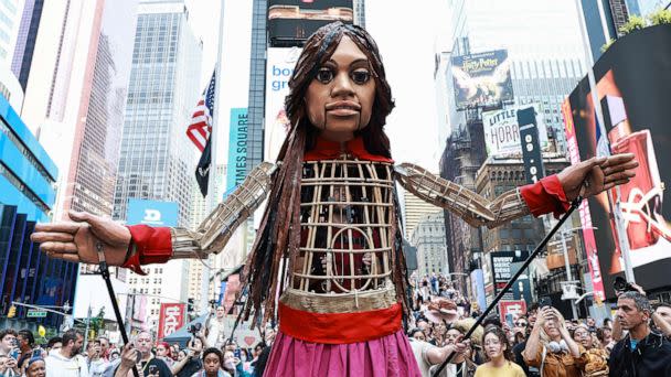PHOTO: A 12-foot puppet known as 'Little Amal' symbolizing a 10-year-old Syrian refugee girl, walks through Times Square, Sept. 16, 2022, in New York City. (Arturo Holmes/Getty Images)