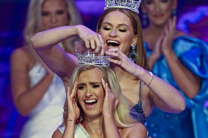 Miss Colorado, Madison Marsh, is crowned by Miss America 2023, Grace Stanke, as this year's winner in Orlando, Fla., on Sunday. Photo by Joe Marino/UPI