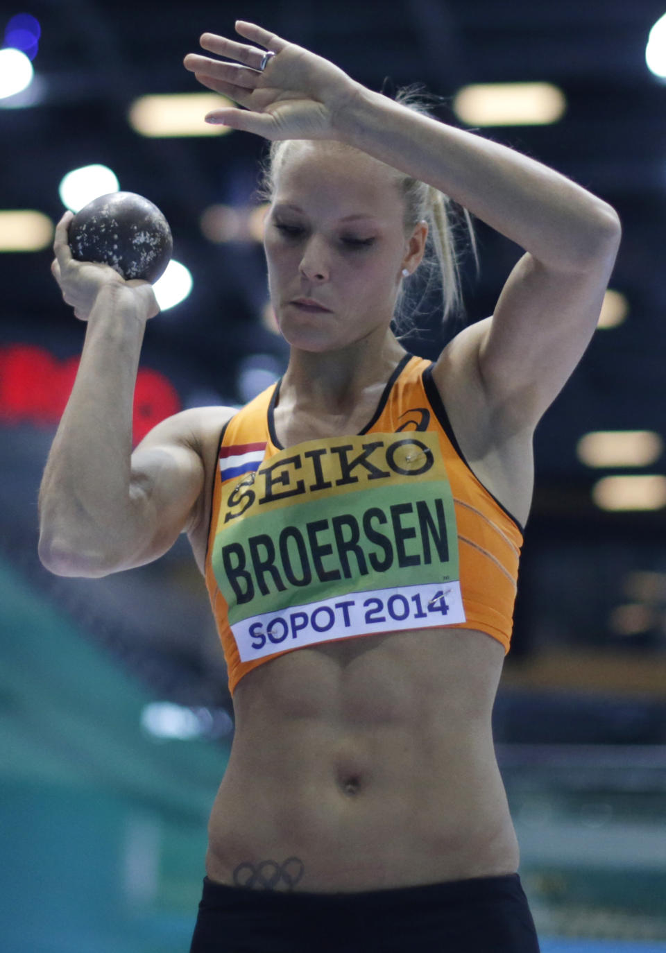 Netherlands' Nadine Broersen holds the shot before making an attempt in the shot put of the women's pentathlon during the Athletics Indoor World Championships in Sopot, Poland, Friday, March 7, 2014. (AP Photo/Matt Dunham)