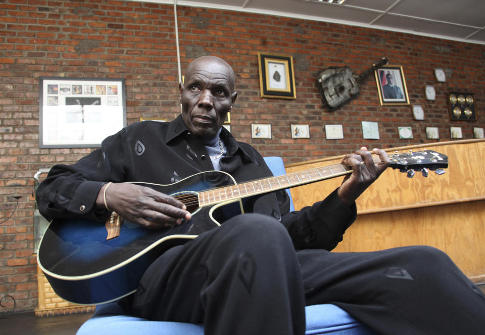 FILE - In this Thursday June 30, 2011 file photo, Zimbabwe music superstar, Oliver Mutukudzi plays in his music academy in Norton about 40 kilometres from Harare. Zimbabwean musician and world music star Oliver Mtukudzi dies in Harare at age 66, it was announced Wednesday, Jan. 23, 2019. (AP Photo/Tsvangirayi Mukwazhi, file)