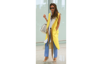 <p>Victoria donned one of her famous monochrome looks in summery hues. She is wearing a Victoria Beckham coat and bag.</p>