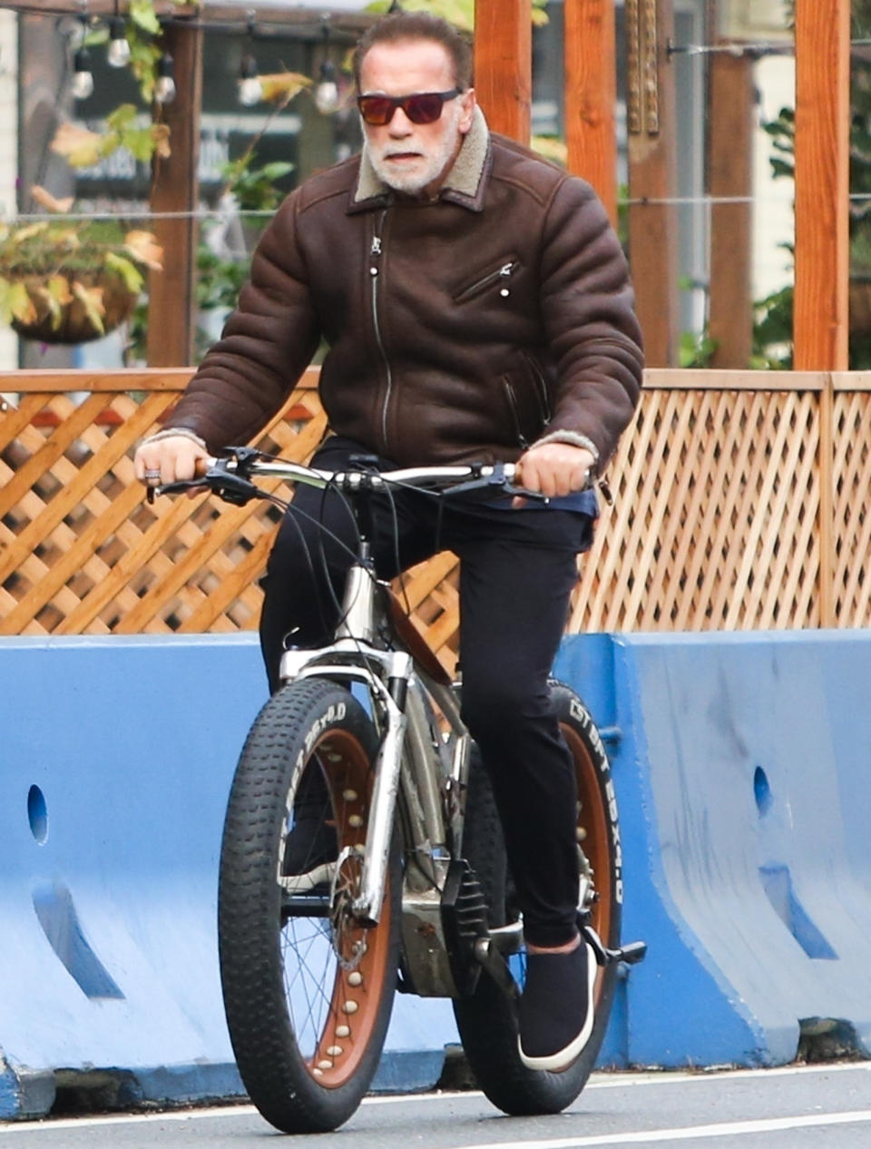 <p>Arnold Schwarzenegger rocks sunglasses as he rides through Santa Monica on his bike on Jan. 19.</p>