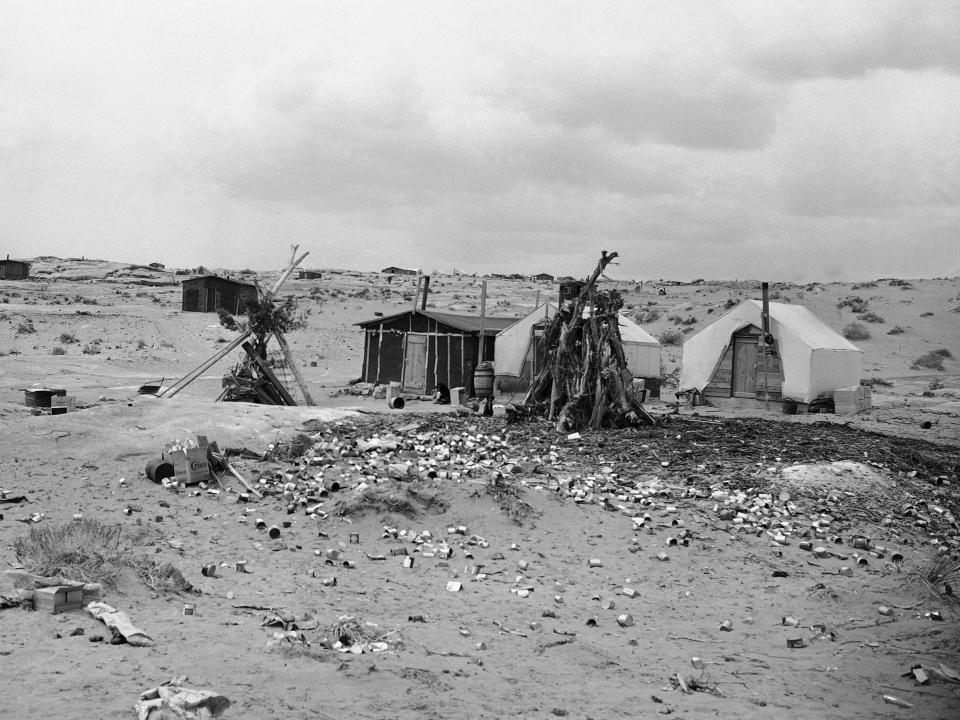 Tents and cabins of Native American uranium miners dot the hillside in the Navajo reservation in Arizona, in 1952.