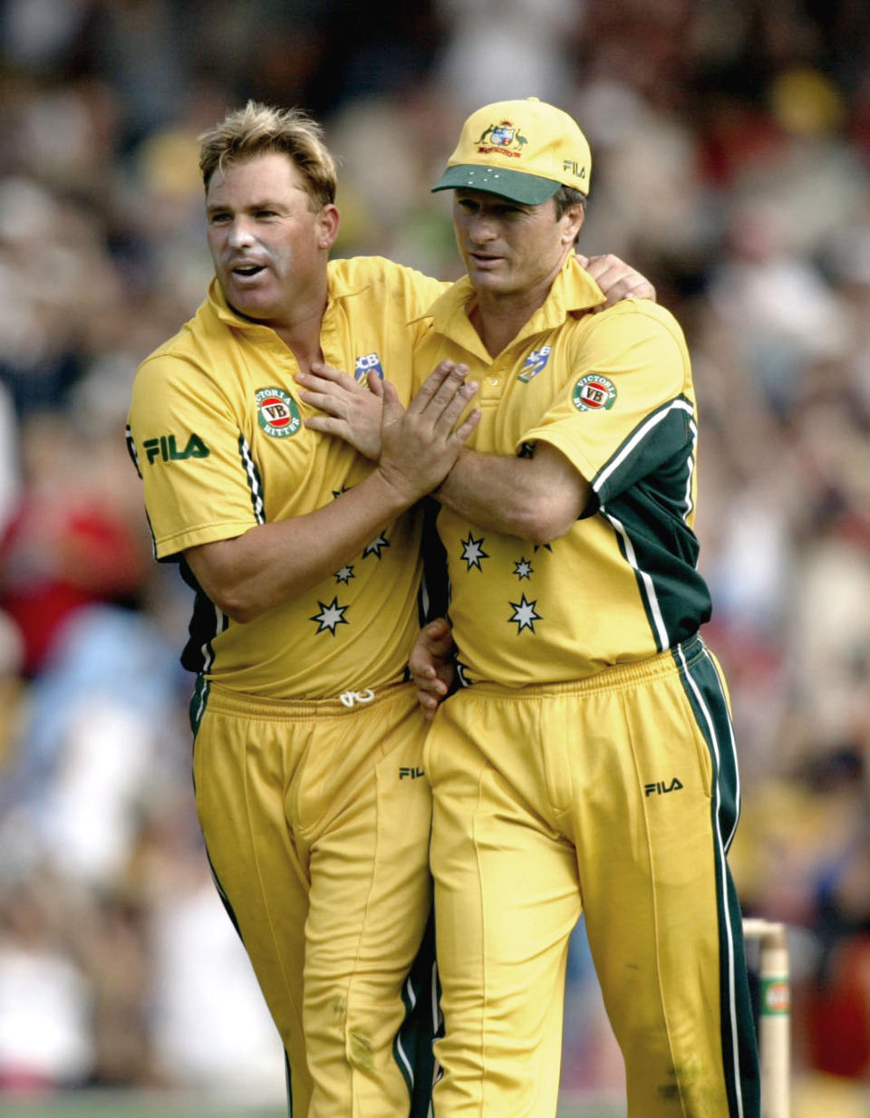 Steve Waugh celebrates and hugs Shane Warne to celebrate the wicket of Chris Carins of New Zealand.