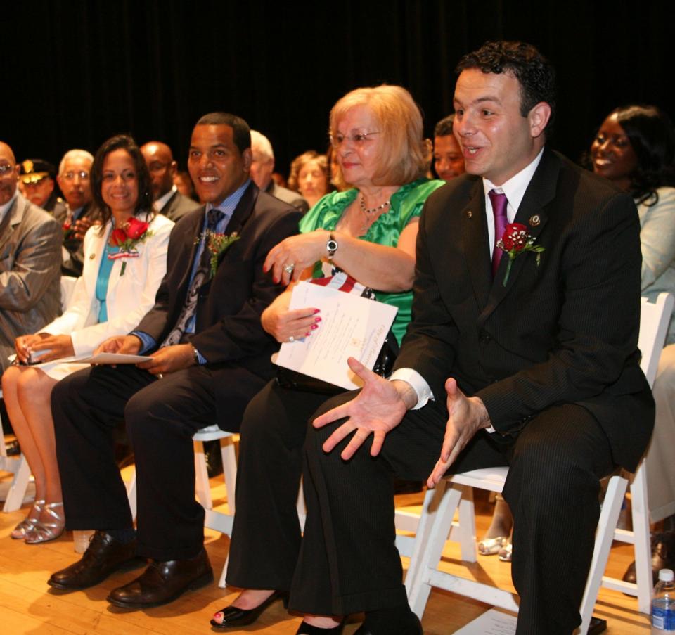 48214 -- Paterson, New Jersey -- July 01, 2008 -- The Inaugural Ceremony for the City of Paterson featured the swearing in of two new members of teh City Council. l to r, Luisa Rosario, girlfriend to newly sworn in Councilman Julio Tavares, Raymonde Sayegh, mother of newly sworn in Councilman Andre Sayegh. -- Chris Pedota / The Record