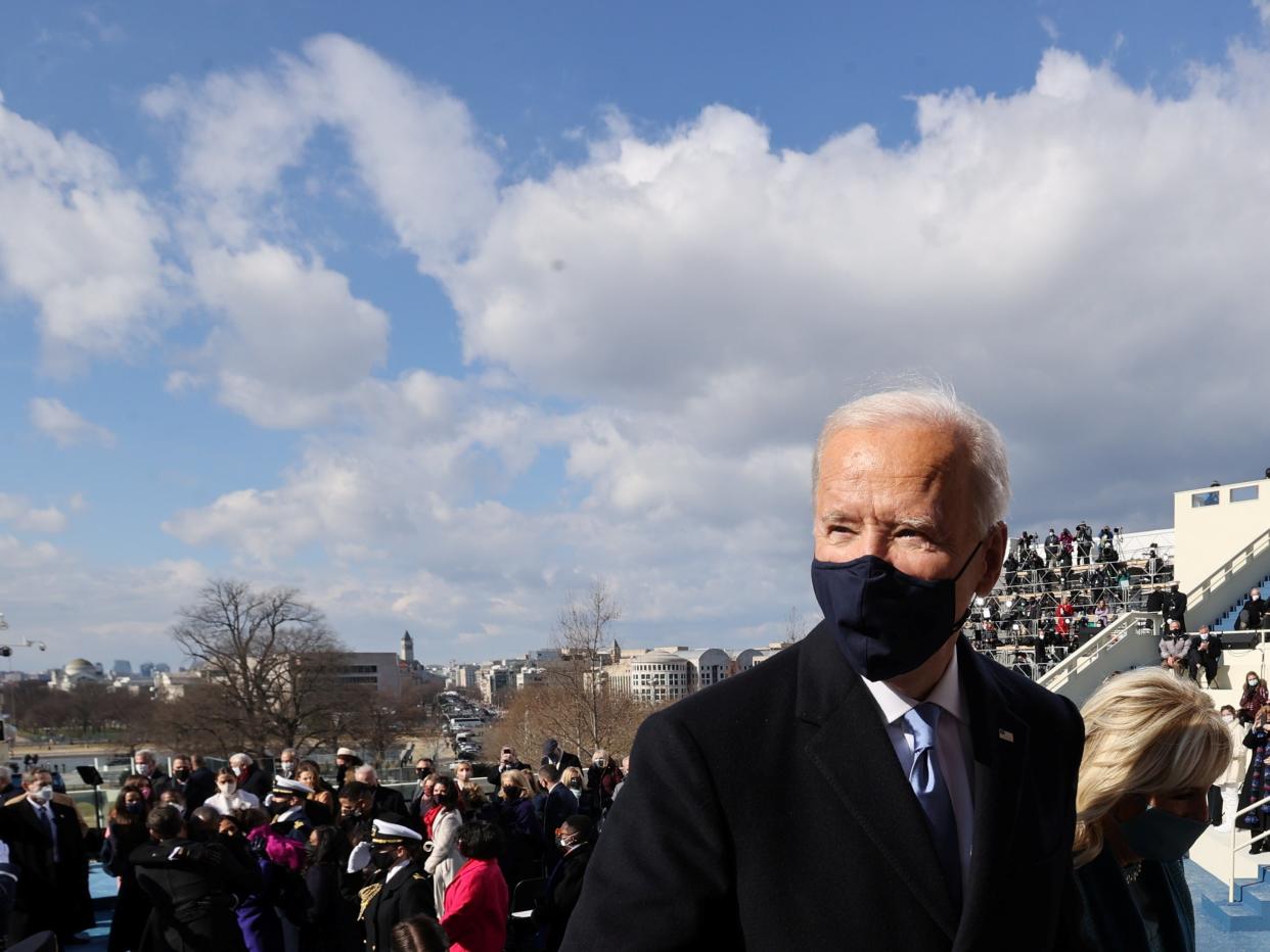 <p>President Joe Biden and the first lady Dr Jill Biden leave Wednesday’s inauguration ceremony at the US Capitol in Washington</p> (Reuters)