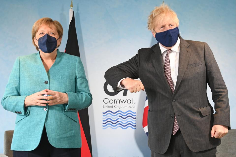 Prime Minister Boris Johnson greets German Chancellor Angela Merkel, ahead of a bilateral meeting during the G7 summit in Carbis Bay (Getty Images)