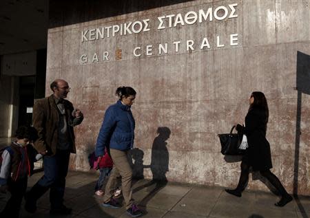 People walk in front of a closed main railway station during a general 24-hour labour strike in Athens April 9, 2014. REUTERS/Alkis Konstantinidis