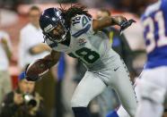 TORONTO, ON - DECEMBER 16: Sidney Rice #18 of the Seattle Seahawks runs after a catch against the Buffalo Bills at Rogers Centre on December 16, 2012 in Toronto, Ontario.Seattle won 50-17. (Photo by Rick Stewart/Getty Images)