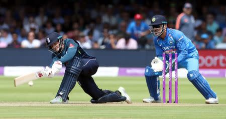 Cricket - England v India - Second One Day International - Lord’s Cricket Ground, London, Britain - July 14, 2018 England's Joe Root in action as India's MS Dhoni looks on Action Images via Reuters/Peter Cziborra