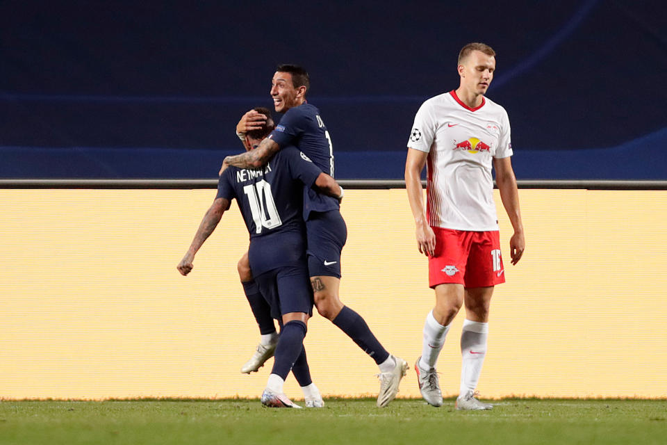 Paris Saint-Germain's Argentine midfielder Angel Di Maria (R) celebrates with Paris Saint-Germain's Brazilian forward Neymar after scoring his team's second goalduring the UEFA Champions League semi-final football match between Leipzig and Paris Saint-Germain at the Luz stadium in Lisbon on August 18, 2020. (Photo by Manu Fernandez / POOL / AFP) (Photo by MANU FERNANDEZ/POOL/AFP via Getty Images)