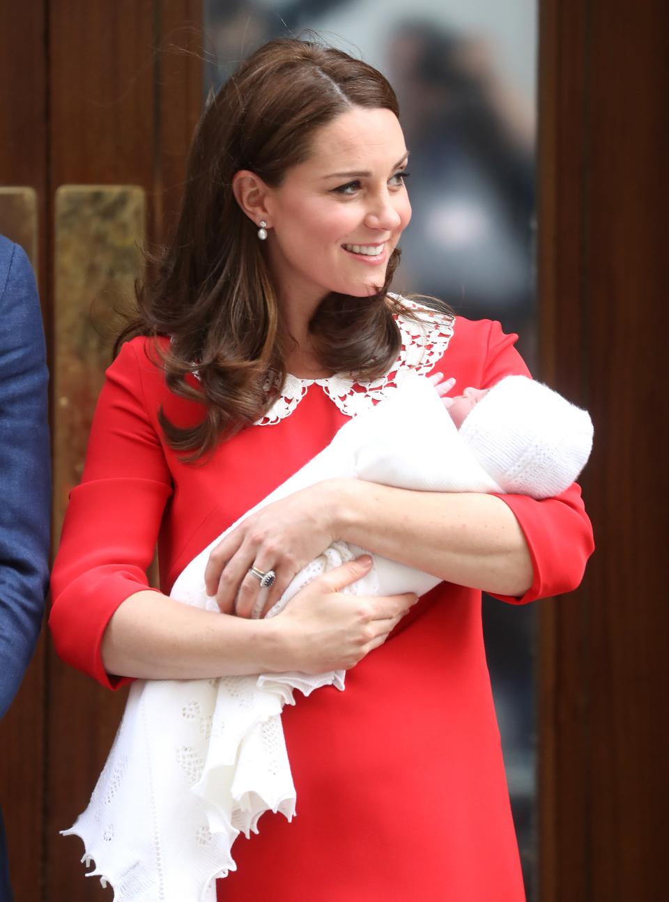 Kate Middleton wore a red Jenny Packham dress for her newborn baby's debut—and it's two nods in one to the late Princess Diana. See the full look here.