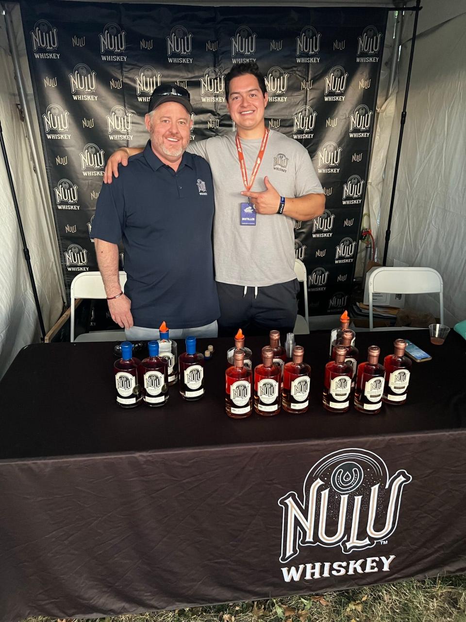 Chase Hazelbaker, right, with his father R. Keith Hazelbaker, left, the CEO of NuLu Whiskey.