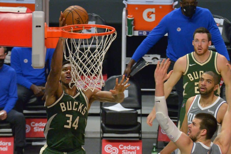 Milwaukee Bucks forward Giannis Antetokounmpo briefly sat in a courtside seat after he was ejected during a win over the Detroit Pistons on Wednesday in Milwaukee. File Photo by Jim Ruymen/UPI