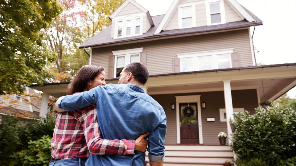 Couple Walking Towards House