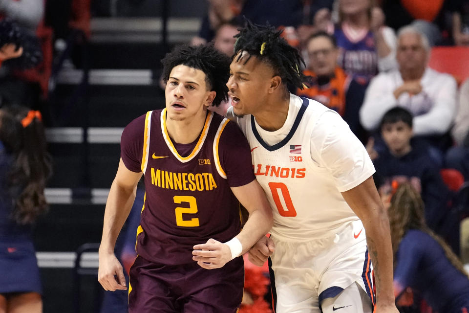 Illinois's Terrence Shannon Jr. (0) gives Minnesota's Mike Mitchell Jr. an earful after Shannon Jr., scored a 3-point basket on Mitchell Jr., during the second half of an NCAA college basketball game Wednesday, Feb. 28, 2024, in Champaign, Ill. Illinois won 105-97. (AP Photo/Charles Rex Arbogast)