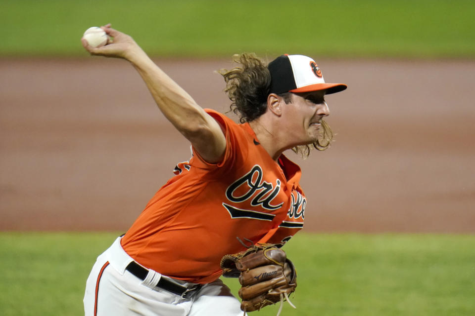 Baltimore Orioles starting pitcher Asher Wojciechowski throws a pitch to the Washington Nationals during the second inning of a baseball game, Saturday, Aug. 15, 2020, in Baltimore. (AP Photo/Julio Cortez)