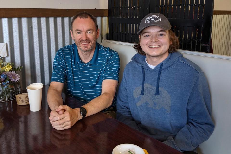 Christian Glass, right, sits with his father, Simon Glass, in Colorado on March 11, 2021. Family members are asking for accountability in the death of Christian Glass, a 22-year-old Colorado man who was shot by police earlier this year after calling 911 for roadside assistance. Christian Glass's parents believed officers escalated a situation that could have been handled differently, and hope the district attorney will bring criminal charges.